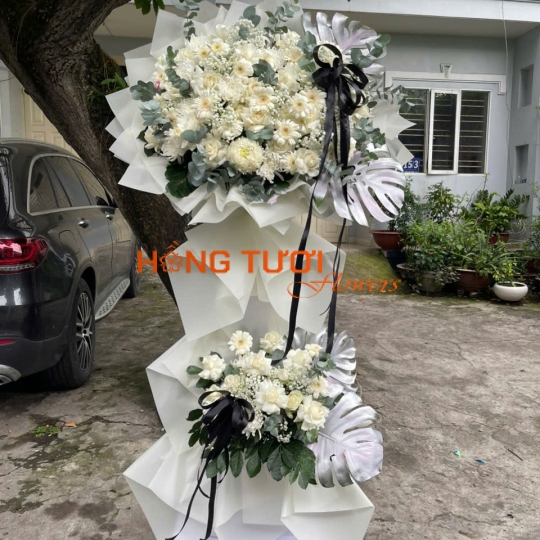 Kệ Hoa Chia Buồn Trắng Hai Tầng Phối Nơ Đen