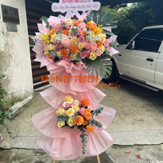 Kệ Hoa Tươi Hai Tầng Hồng Pastel Phối Hoa Hồng Cam