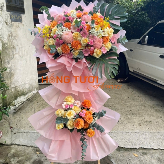 Kệ Hoa Tươi Hai Tầng Hồng Pastel Phối Hoa Hồng Cam